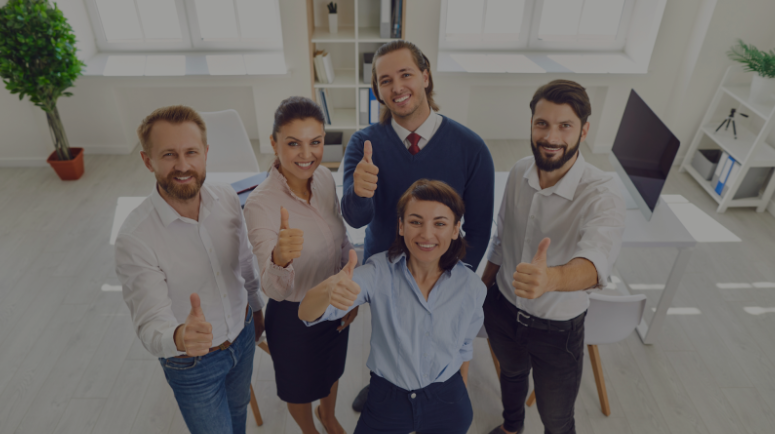 A group of business professionals smiling and giving thumbs up, promoting a partnership with a web marketing company.