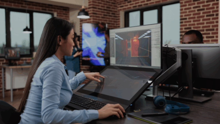 A woman working on a computer in an office, representing Scalecode Solution, a web development company in Bangalore.