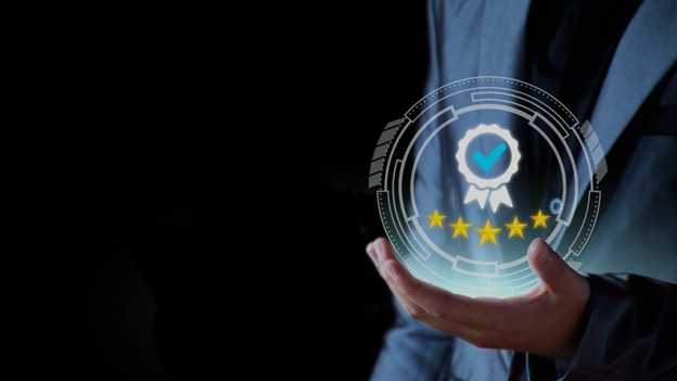 A man in a suit holds a glowing orb with five stars, symbolizing high-quality web design by Scale Code Solutions.